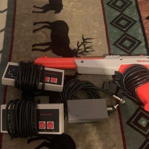 Nes accessories 2 controllers, the duck hunt gun and hook up.